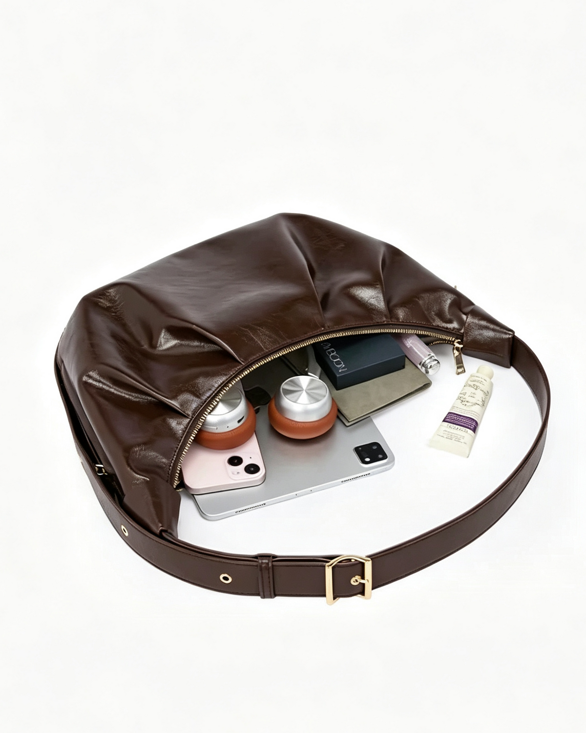 Medium pleated crescent bag fitting an iPad mini and daily essentials