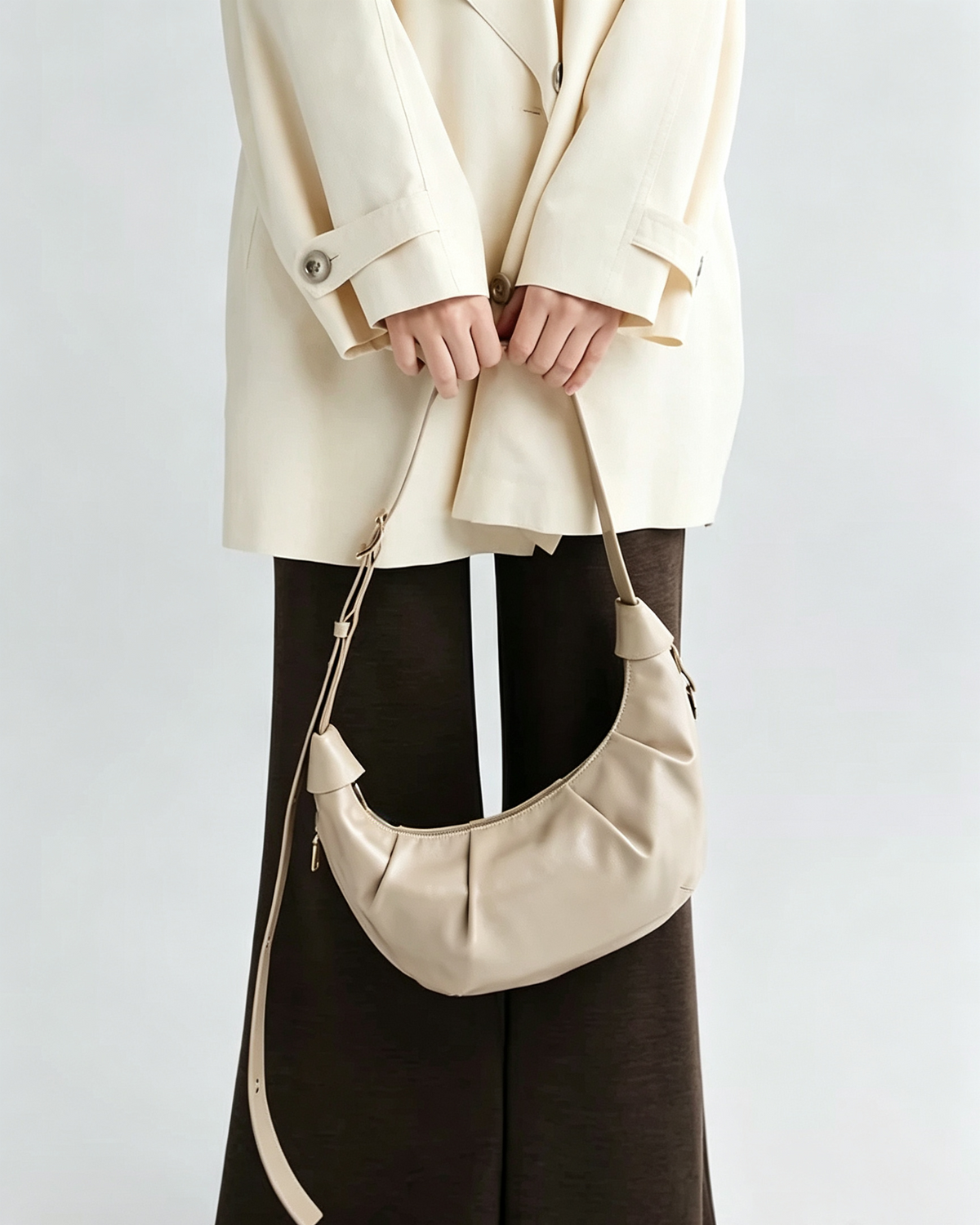 Crescent shoulder bag styled with everyday essentials